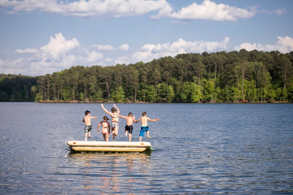 Kids jumping into water