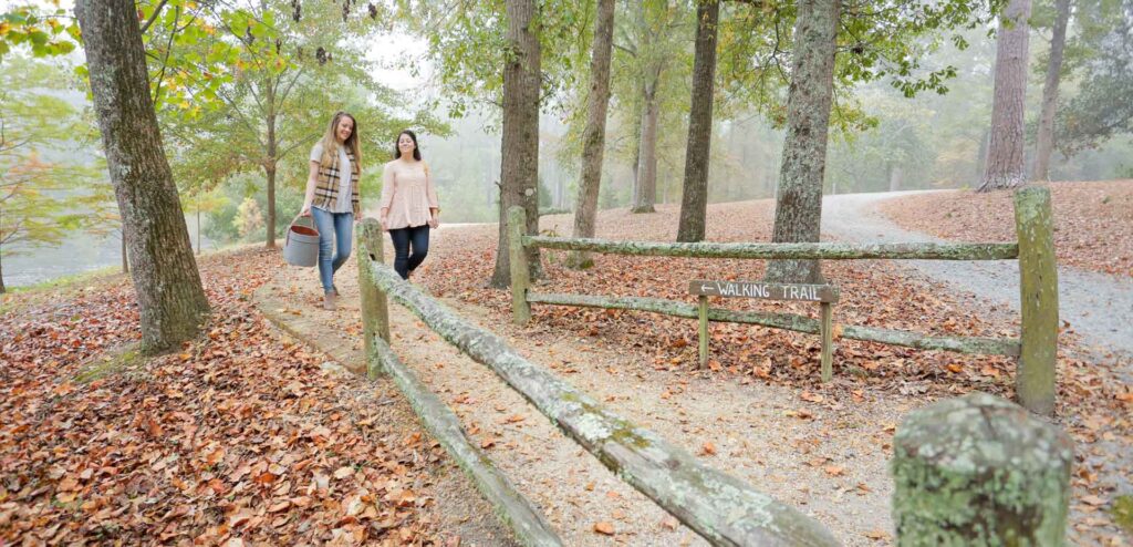 Friends walk the trails at Lockerly Arboretum