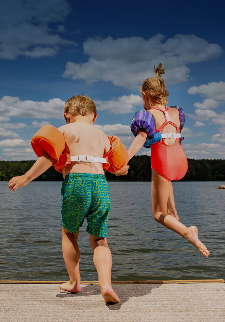 Kids jumping from dock into water - mobile